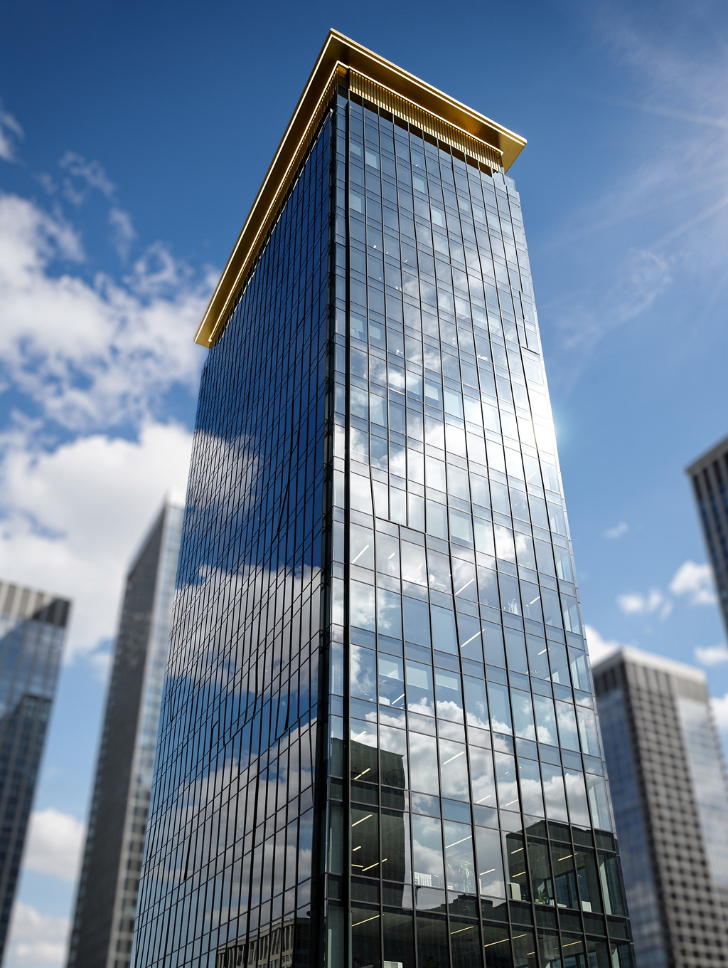 Modern glass office building reflecting city skyline